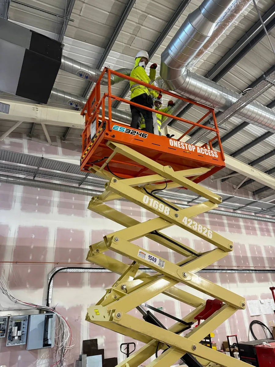 Ventilation installer on elevated platform